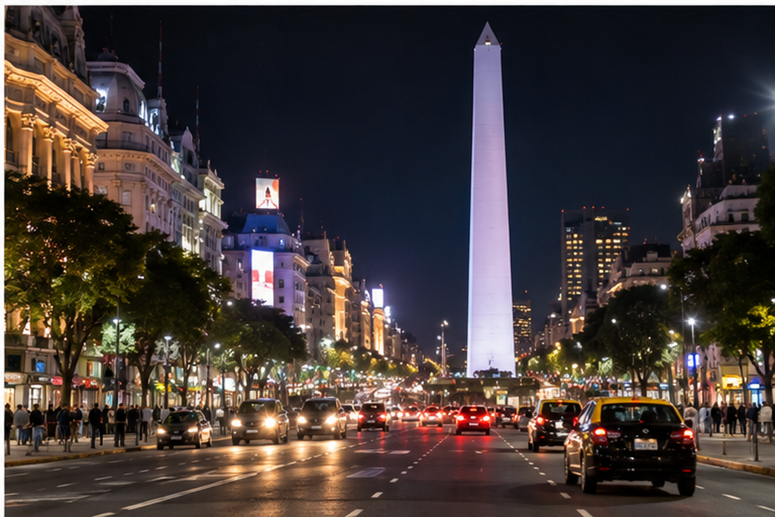 Buenos Aires after midnight with the illuminated Obelisk, traffic and city lights