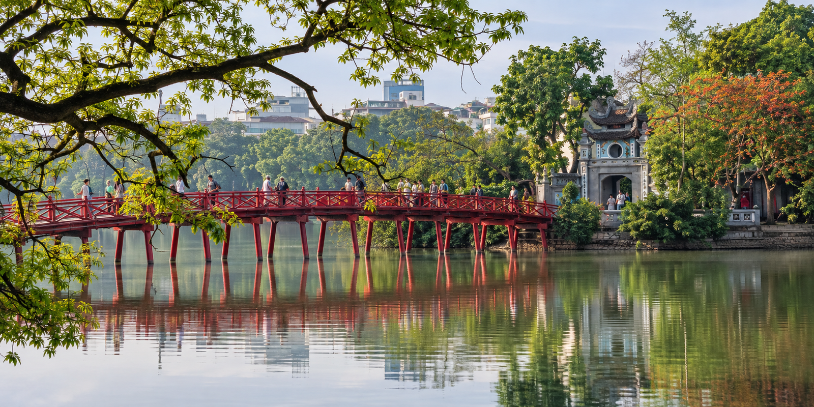 Hoan Kiem Lake and red The Huc Bridge on a calm Hanoi morning