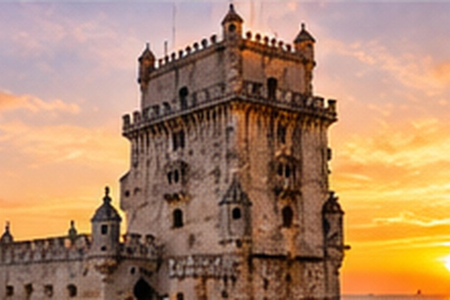 Belém Tower beside the Tagus River in Lisbon during warm evening light